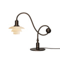 Louis Poulsen PH 1/1 Piano Table Lamp, Limited Edition, aged brass table lamp with dusty terracotta glass shades, lit, on a white background