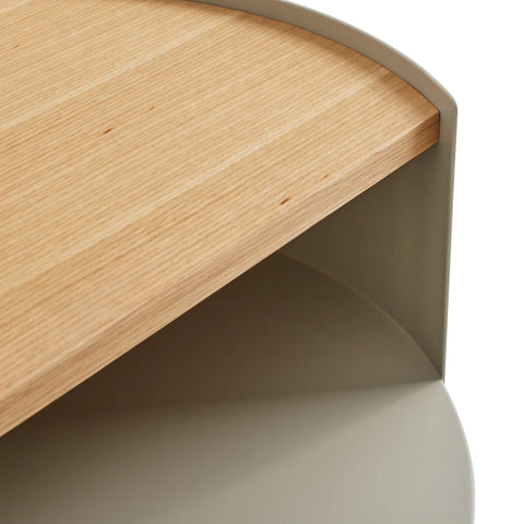 Close-up of the white oak veneer top and putty powder-coated steel frame on the Blu Dot Li'l Something Side Table