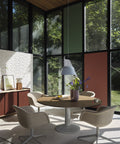 Scandinavian dining room with big windows featuring Muuto fiber soft armchair 