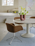 Muuto Midst Table with round marble top styled with modern vase and dining chairs – Scandinavian interior