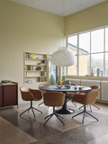 scandinavian dining room with large pendant above table and furniture from muuto 