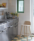 scandinavian kitchen with muuto nerd counter stool in oak 