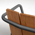 Offline Outdoor Chair by Blu Dot, beveled teak back slats and carbon powder-coated aluminum rail detail