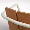 Offline Outdoor Chair by Blu Dot, beveled teak back slats and white powder-coated aluminum rail detail