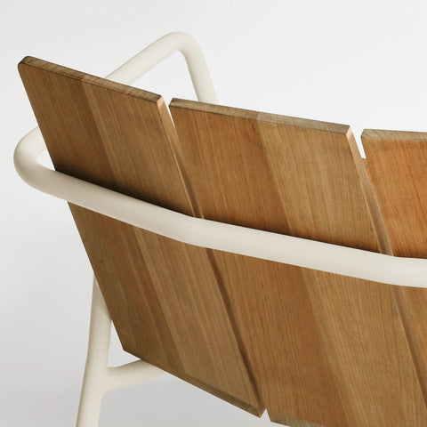 Offline Outdoor Lounge Chair by Blu Dot, beveled teak back slats and white powder-coated aluminum rail detail