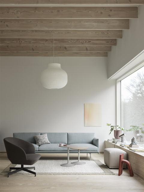 calm scandinavian living room with muuto sofa, armchair and coffee tables