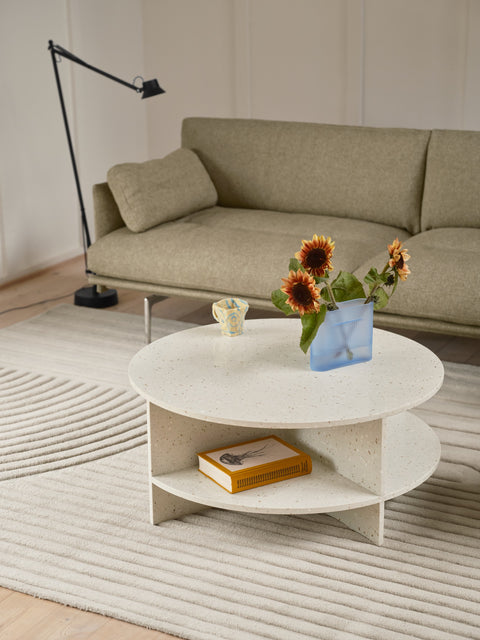 Muuto Halves Coffee Table in off white terrazzo styled with Outline Sofa and Dedicate floor lamp