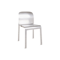 Frama Rivet Chair in Aluminum, metal chair with a curved back shell and slim square legs, three quarter view on white