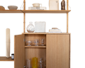 Frama Shelf Library Medium Cabinet Section in Natural Oak, cabinet with one door open showing glassware, ceramics and books on the shelf above