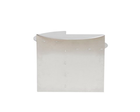 Frama Rivet Side Table in Aluminum, front view of the curved aluminum panel with a vertical row of rivets down the seam