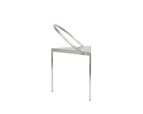 Frama Triangolo Chair in Stainless Steel, side profile with the hoop back seen edge on above the triangular seat and three slim legs