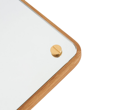 Frama RM-1 Rectangular Mirror, close up of a rounded corner where the oak edge meets the glass with a brass screw head