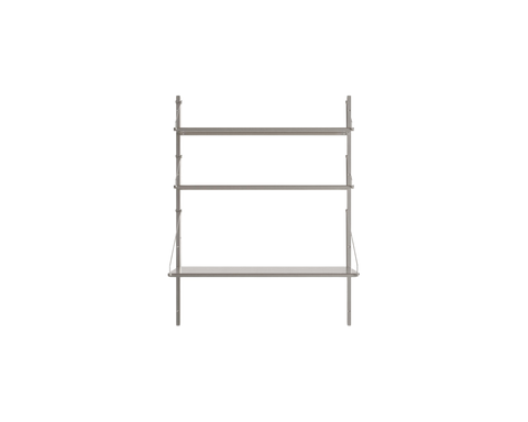 Frama Shelf Library Desk Section in Stainless Steel, shorter steel wall frame with a desk shelf and one upper shelf, shown on white