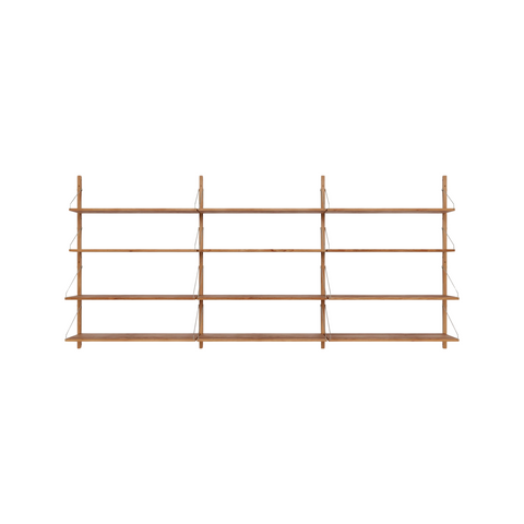 Frama Shelf Library Triple Section in Natural Oak, three bays of oak shelves on a wall rail, four shelves across, on white