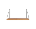 Frama Single Shelf, Natural Oak in Black, oak board on two slim black wire brackets, seen straight on against a pale ground