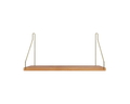 Frama Single Shelf, Natural Oak in Brass, oak board carried on two brass wire brackets, straight on view against pale grey