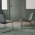 minimalist lounge chair with grey fabric and black metal sled base in scandinavian style 