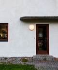 outdoor round surface mount wall lamp by louis poulsen