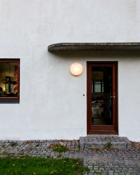 outdoor round surface mount wall lamp by louis poulsen