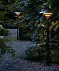 PH 3-2½ outdoor Bollard Lighting by louis poulsen in a garden