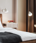 vl38 wall lamp designed by vilhelm lauritzen for louis poulsen in a bedroom