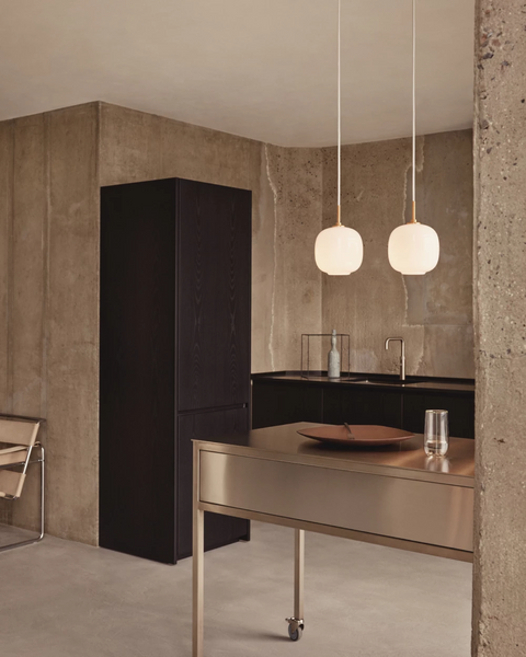 VL45 Radiohus Pendant above a kitchen island designed by Vilhelm Lauritzen for Louis Poulsen