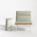Perch Outdoor Lounge Chair by Blu Dot in Sunbrella Oasis with white aluminum frame and teak slats, styled with Circula Tall Side Table in Putty
