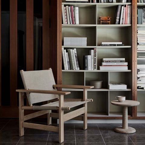 scandinavian living room with minimalist bookcase 