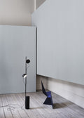 Muuto Post Floor Lamp with warm, ambient light and contemporary style.