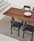 black dining chairs and smoked oak dining table designed by fredericia furniture