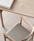 close up shot of post dining chair and post dining table by Fredericia Furniture 