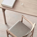 close up shot of post dining chair and post dining table by Fredericia Furniture 