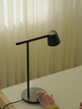 Muuto Tip Table Lamp - Watch the design and functionality of this modern Scandinavian desk lamp in action.