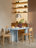 Muuto Re Norm Table 130 in light blue with oak chairs and Ambit pendant in brushed aluminum