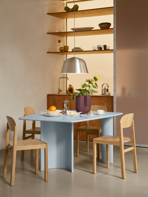 Muuto Re Norm Table 130 in light blue with oak chairs and Ambit pendant in brushed aluminum