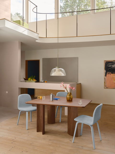 Muuto Re Norm Table 130 in walnut veneer with Visu chairs in Scandinavian dining interior