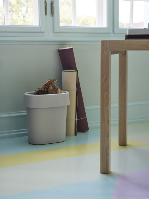 Stylish Reduce Paper Bin by Muuto in a modern home office setting, with papers neatly organized in the minimalist design.