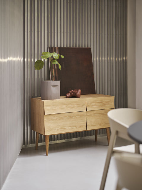 scandinavian sideboard with minimalist and modern planter