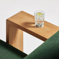 Ridge Outdoor Lounge Chair by Blu Dot, wide teak arm surface in Sunbrella Ivy