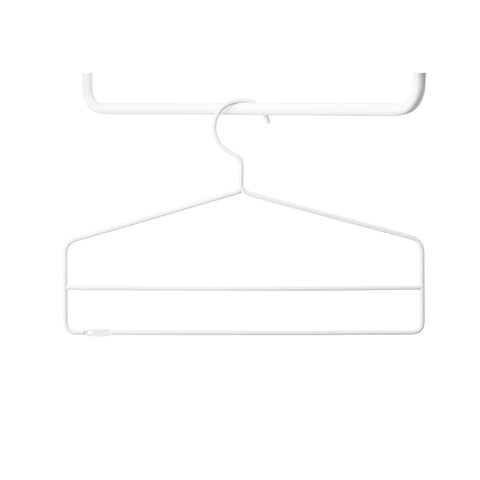 Close-up of single white String® System coat hanger.