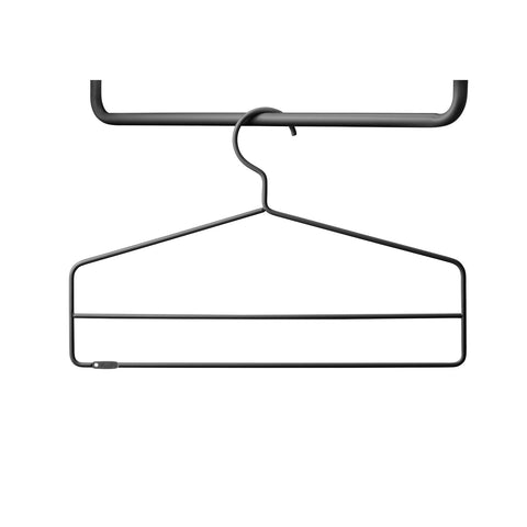 Close-up of single black String® System coat hanger.