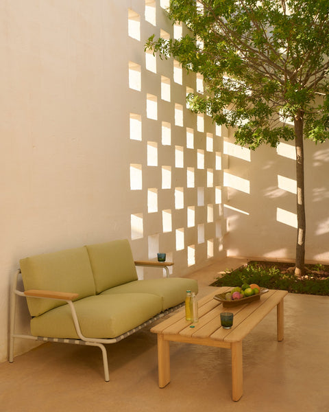 Assemble Coffee Table 135 in teak by Muuto with Settle 2 Seater Sofa and Raise Glassware