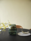 Contemporary dining area with Muuto Silent Vase in Glass as the centerpiece, adding subtle elegance to the table.