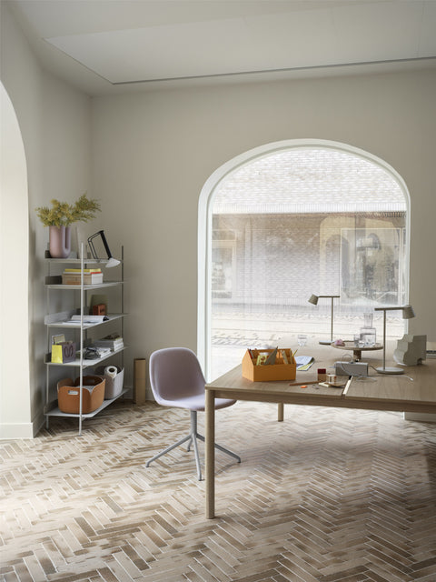 scandinavian office with minimalist bookshelf and oak desk by muuto 