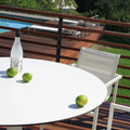 Skiff 47" Large Outdoor Café Table by Blu Dot, solid laminate tabletop detail styled on outdoor deck