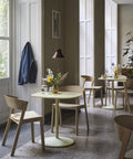 cover side chair designed by muuto in a scandinavian restaurant 