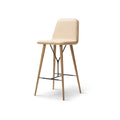 Angled view of Fredericia Spine Barstool with Backrest in lacquered oak with leather seat and steel footrest