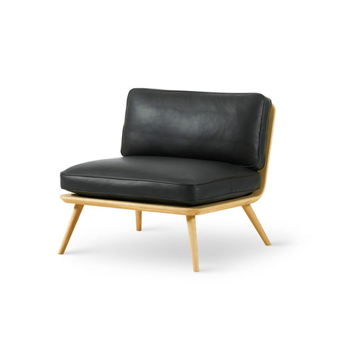 Spine Lounge Chair 1710 by Fredericia, black leather on natural oak frame, three quarter view, designed by Space Copenhagen.