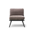 Spine Lounge Chair by Fredericia in black leather with solid wood legs – studio product image