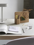 Stylish office wall with Muuto Story Pinboard showcasing organizational tools and artistic decor.